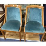 A pair of Biedermeier style birch tub chairs, height 85cm