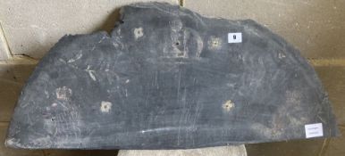 A slate panel decorated with traces of a painted armorial, c.1850, width 80cm height 34cm