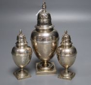 A suite of three late Victorian silver pepperettes by George Fox, London, 1899/1900, tallest 17cm,