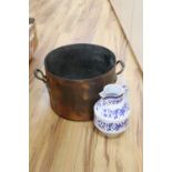 A large copper two handled preserve pot and a large modern blue and white pottery jug