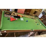 An early 20th century mahogany slate bed snooker table and accessories, width 194cm, depth 102cm