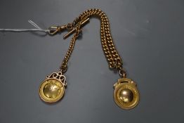 An early 20th century 9ct gold curblink albert, hung with two engraved 9ct gold medallions, gross