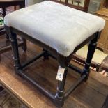 A 17th century oak stool with upholstered seat, width 55cm, depth 42cm, height 56cm