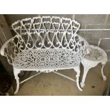 A painted cast aluminium garden bench, width 95cm, together with a circular table