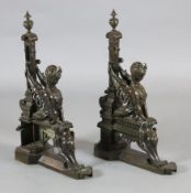 A pair of 19th century French bronze chenets, modelled with sphinx beside squared columns on stepped