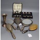 Two sets of silver coffee spoons, five hair brushes and a silver vase.