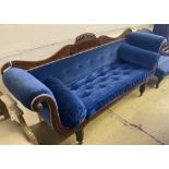An early Victorian mahogany scroll arm settee upholstered in blue velvet, width 200cm, depth 56cm,
