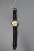 A gentleman's 1950's steel Longines manual wind wrist watch, on later strap, case diameter 34mm,