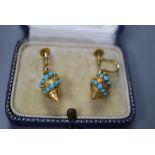 A pair of yellow metal (tests as 15ct) and turquoise set pear shaped drop ear clips, 17mm, gross 4