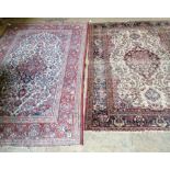 An Isfahan rug (worn) and another rug, largest 216 x 132cm