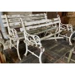 A pair of Victorian style slatted aluminium garden benches (in need of repair), width 122cm