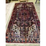 A Hamadan rug 295cm x 142cm