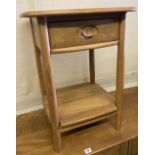 An Ercol light elm two tier occasional table, width 49cm, depth 43cm, height 65cm