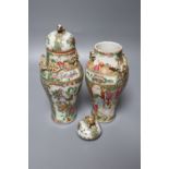 A pair of late 19th century Chinese famille rose vases and covers, height 22cm