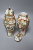 A pair of late 19th century Chinese famille rose vases and covers, height 22cm