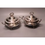 A pair of early 19th century Old Sheffield plate circular two-handled tureens and covers, acanthus-