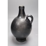 A Martin Brothers black glazed flagon, signed and dated 1909, height 23cm