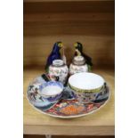 A pair of Chinese parrots, a pair of Samson vases, an Imari dish and three bowls