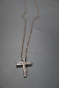 A modern 18ct white gold and diamond set cross pendant, 24mm, on an 18ct white gold chain, gross 4.4