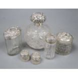 A late Victorian silver mounted cut glass scent bottle, Chester, 1900 and five silver mounted toilet