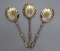 A set of three late Victorian silver fancy serving spoons with figural terminals, Goldsmiths &