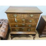 An 18th century cross banded walnut chest on stand, width 98cm, depth 56cm, height 121cm