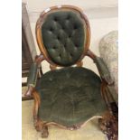 A Victorian carved walnut spoonback armchair, width 62cm, height 94cm