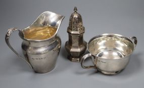 A 1930's silver cream jug, a silver sugar bowl and a silver caster, 9oz.