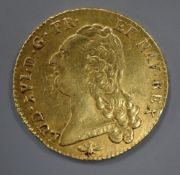 A Louis XVI two Louis d'Or coin, 1787D, VF.