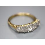 An 18ct gold and diamond five-stone ring, size L/M, gross 3 grams.CONDITION: The largest stone and