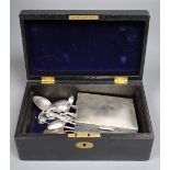 A silver cigarette box and assorted small silver flatware, in a morocco leather jewellery box.