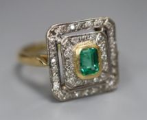 A modern 18ct gold, emerald and diamond chip cluster tablet ring, size O, gross 4.9 grams, (stone