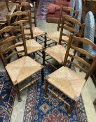 A late 19th / early 20th century set of six ash rush seated ladderback dining chairs