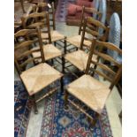 A late 19th / early 20th century set of six ash rush seated ladderback dining chairs
