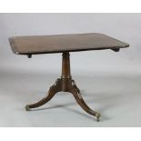 A Regency coromandel wood banded mahogany breakfast table, with rectangular tilt top, canon barrel