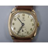 A gentleman's 1940's 9ct gold Tudor manual wind wrist watch, with case back inscription, on