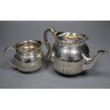 A Victorian silver teapot and matching sugar bowl, London, Charles Boyton II, 1878, gross 16oz.