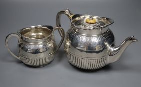 A Victorian silver teapot and matching sugar bowl, London, Charles Boyton II, 1878, gross 16oz.