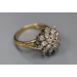 A modern 18ct gold and diamond cluster ring, size J, gross 4.2 grams.