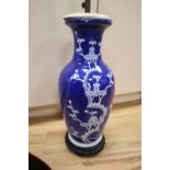 A large Chinese blue and white prunus vase, mounted as a table lamp, drilled base, total height