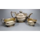 A George III demi fluted silver three piece tea set, by Emes & Barnard, London, 1811, with