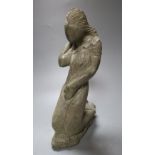 A carved mineral figure of a kneeling female, 32cm