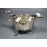 A George V silver sauceboat, London, 1911, height 12.4cm, 13oz.CONDITION: The top of the handle