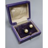 A pair of yellow metal and cultured pearl ear clips, pearl diameter 7.4mm.