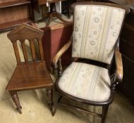 A late Victorian mahogany framed armchair, with floral striped upholstered seat and back and a