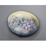 An early 20th century sterling and porcelain oval brooch, decorated with flowers, 31mm.