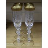 A set of six Bohemian gilt rimmed champagne flutes, 24cm