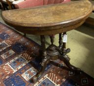 A Victorian inlaid walnut demi-lune folding card table, width 90cm, depth 44cm, height 70cm