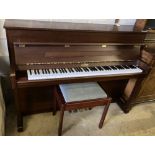 A Kemble upright piano and stool, width 150cm