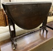 A mid Victorian oak Sutherland table, width 90cm height 74cm